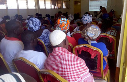 Sugar refinery workers in Ashianyo discussing and voting on production schedules as part of the workers' self-management present in Asase Lewa's participatory-based economic system.