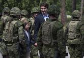 Moreau and his son Preston inspect Armed Forces personnel in Tofino.