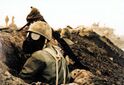 A Bakran soldier in a trench facing Ramidian positions, 1995.