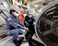 Navy mechanics in ship maintenance exercises.