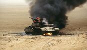 A burning and abandoned Wasinian T-55, 1997.
