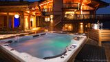 Hot-tub and yard area of a chalet.